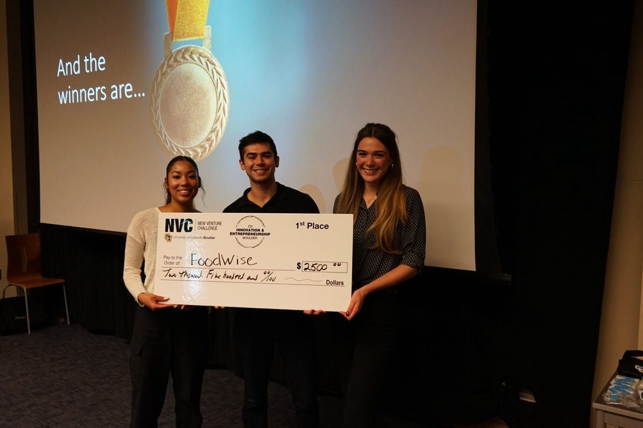 A winning student team with their bounty checks