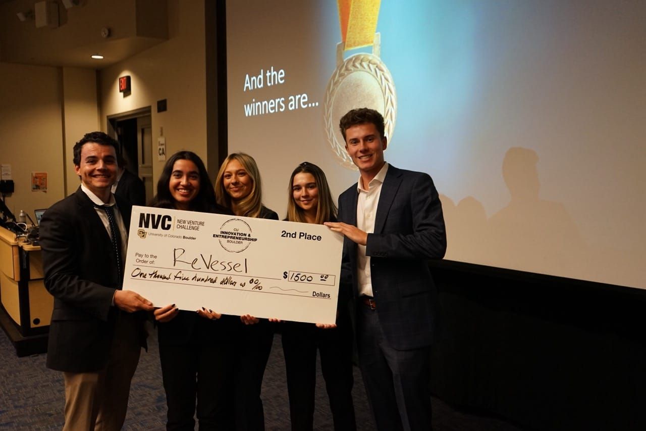 Students celebrating with their award